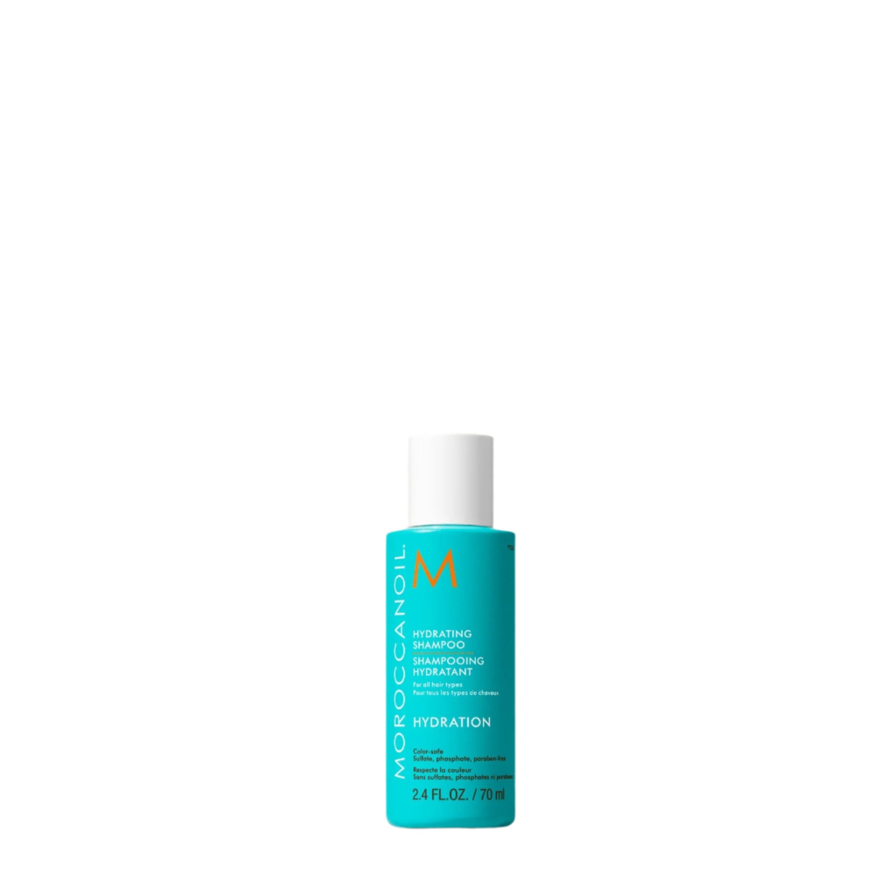 Blue bottle of Moroccanoil product on a beige surface
