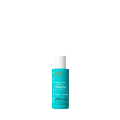 Blue bottle of Moroccanoil product on a light beige background